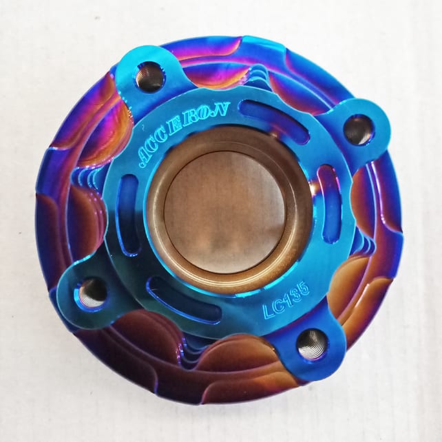 Automotive part coated in pvd rainbow coating