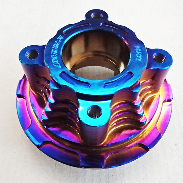 Automotive part coated in pvd rainbow coating